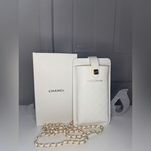 Coco Crush white vegan leather phone case with a gold-tone chain strap